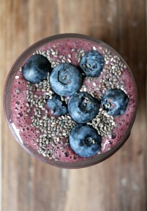 A blueberry power smoothie packed with wild blueberries, strawberries, banana, almond milk, spinach and chia seeds. The perfect pick me up or breakfast!