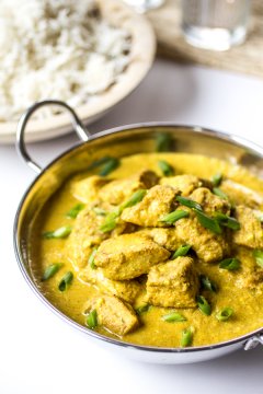 Creamy, spiced Chicken Korma is the stuff dreams are made of. Loosen up those pants and make this delectable Indian dish at home!