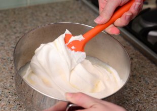 Fold heavy cream into sweetened condensed milk until the mixture is uniform in color