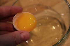 Next,  separate your eggs with whites in one bowl and yolks in another.