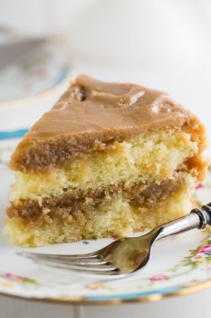 Southern Caramel Cake - moist vanilla cake slathered with lots of ultra-sweet caramel icing.