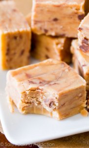 The creamiest, smoothest, peanut butteriest, BEST fudge ever! Only 4 ingredients and no candy thermometer or stove are required. @sallybakeblog
